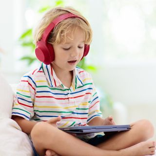 Child listening with headphones